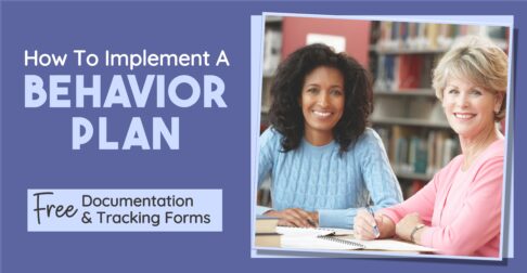 Two teachers writing a behavior intervention plan for a student