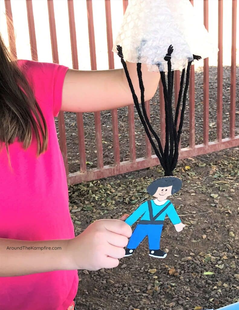 A parachute toy made from a solid, a liquid, and a gas.
