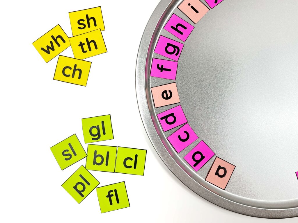 Pizza pan with DIY magnetic letter tile phonics manipulatives for consonant blends and digraphs.