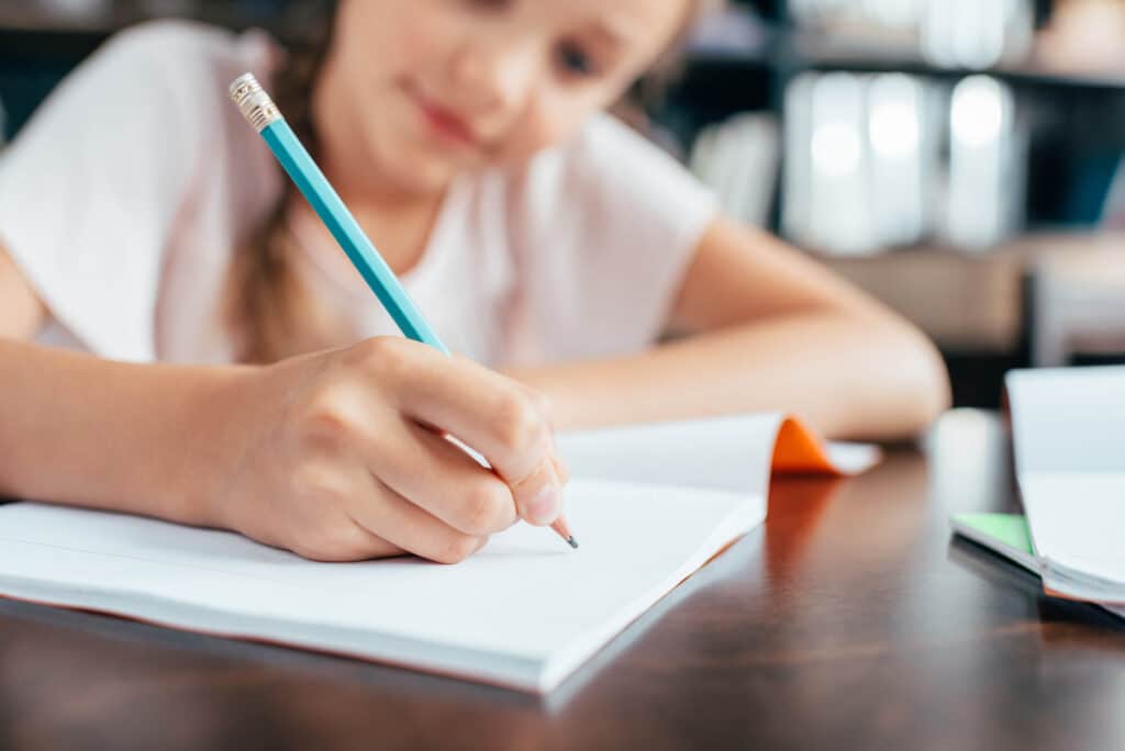 Student learning to write a friendly letter
